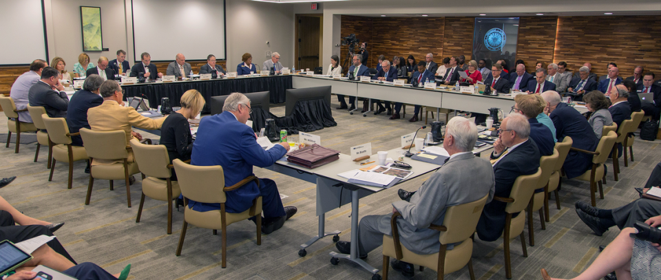 Members of the UNC System Board of Governors gather for a meeting in May 2019.