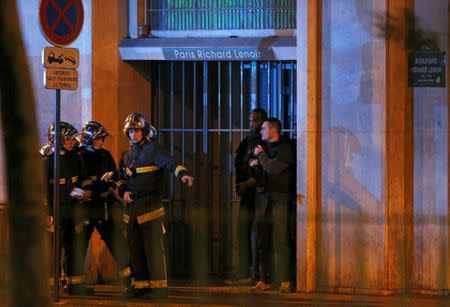 French fire brigade members secure the area near the Bataclan concert hall following fatal shootings in Paris, France, November 13, 2015. REUTERS/Christian Hartmann