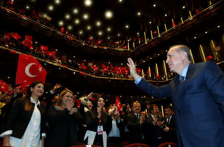 Turkey's President Recep Tayyip Erdogan greets the audience during a meeting in Ankara, Turkey March 29, 2017. Murat Cetinmuhurdar/Presidential Palace/Handout via REUTERS