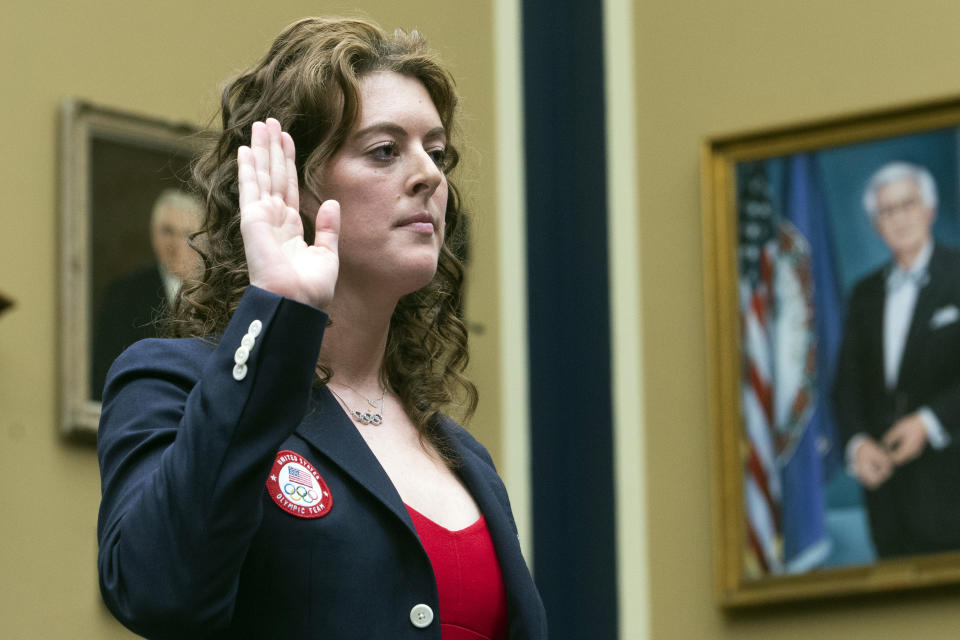 Allison Schmitt, former Olympic athlete, is sworn in during a House Committee on Energy and Commerce Subcommittee on Oversight and Investigations hearing examining Anti-Doping Measures in Advance of the 2024 Olympics, on Capitol Hill, Tuesday, June 25, 2024, in Washington. (AP Photo/Rod Lamkey, Jr.)