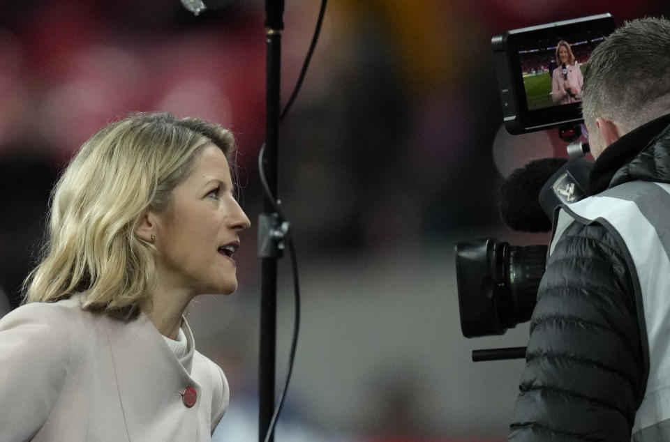 FILE - Jacqui Oatley of Britain's Sky Sports is working for the United States' Fox Sports as a touchline reporter during the women's friendly soccer match between England and the US at Wembley stadium in London, on Oct. 7, 2022. (AP Photo/Kirsty Wigglesworth, File)