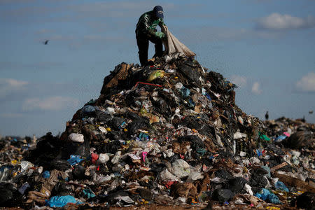 A man works at 'Lixao da Estrutural', Latin America's largest rubbish dump, in Brasilia, Brazil, January 18, 2018. Picture taken January 18, 2018. REUTERS/Ueslei Marcelino