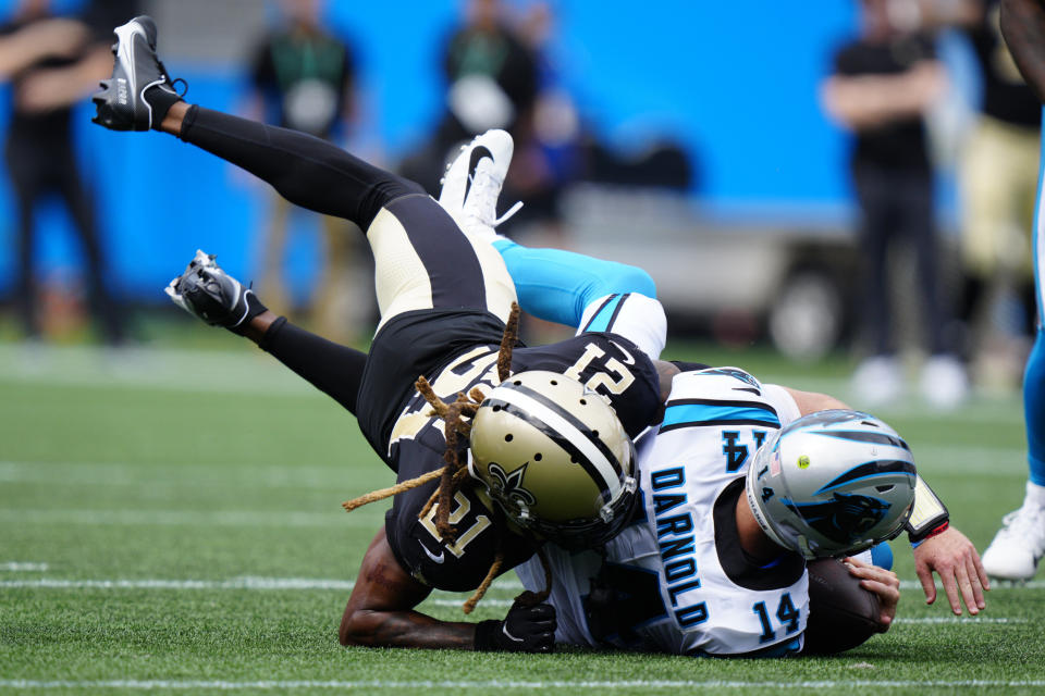 Carolina Panthers quarterback Sam Darnold is sacked by New Orleans Saints' Bradley Roby during the second half of an NFL football game Sunday, Sept. 19, 2021, in Charlotte, N.C. (AP Photo/Jacob Kupferman)