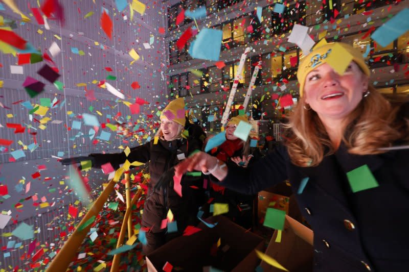 Workers release confetti at midnight in Times Square for the New Year's Eve celebrations in New York City on Monday. Photo by John Angelillo/UPI