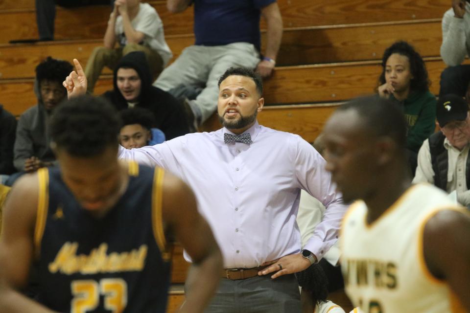 Northwest boys basketball coach Aaron Wallus gives instructions to his team during their District 10 boys basketball game against Northeast Tuesday, Jan. 21, 2020 at Northwest High.