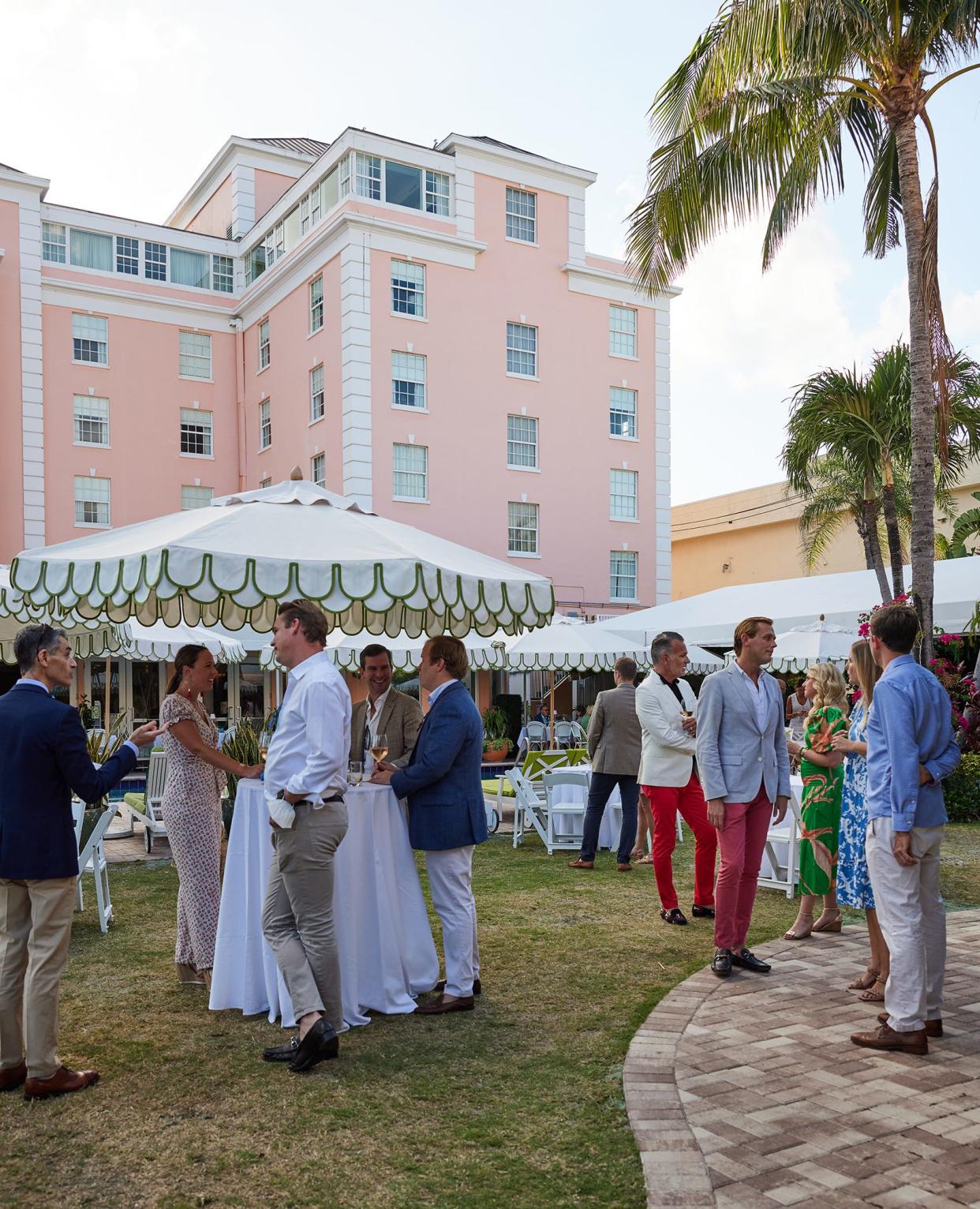 Guests enjoy cocktails and hors d'oeuvres on The Colony lawn.