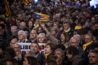 Pro independence demonstrators gather during a protest in Catalonia square in Barcelona, Spain, Tuesday, Feb. 12, 2019. A sensitive trial against a dozen Catalan separatist politicians and activists got underway Tuesday in Spain's Supreme Court amid protests by pro-independence supporters and a highly volatile political environment. (AP Photo/Emilio Morenatti)