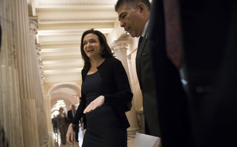 Sheryl Sandberg, chief operating officer of Facebook, goes to speak with members of congress last week about Russian interference during the election. - Credit: Drew Angerer/Getty Images