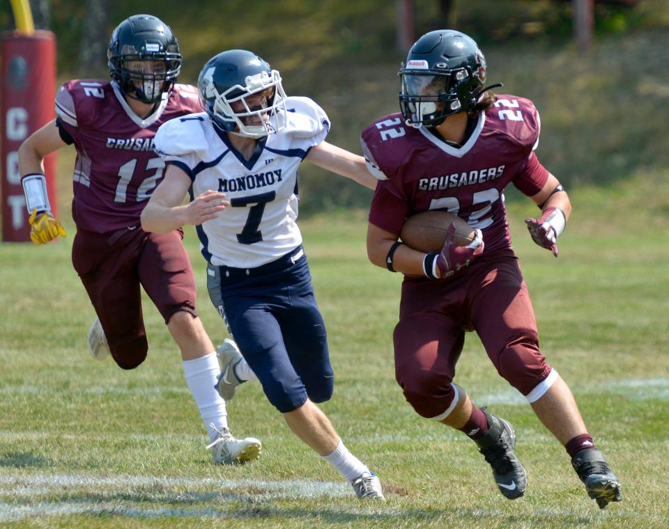 Cape Tech's Peyton Morris, right, makes a second-quarter play before being tackled by Monomoy's Logan Crevier. Cape Cod Regional Technical High School hosted Monomoy Regional High School in football action Saturday afternoon in Harwich. Monomoy beat Cape Tech 29-16. To see more photos, go to www.capecodtimes.com/news/photo-galleries.
