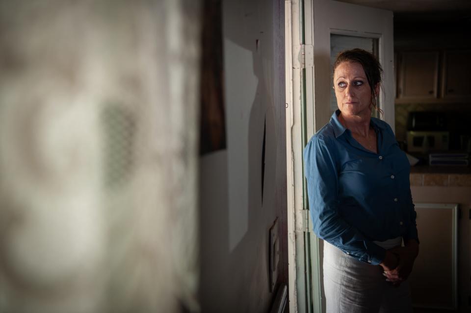 Andie Dettore stands for a portrait in the vacant house where she experienced and witnessed abuse from the Rankin County Sheriff’s Department in Florence on Aug. 28, 2023.