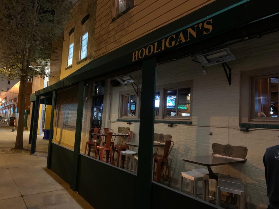 Hooligan's has six outdoor tables that are covered and have above head heaters.