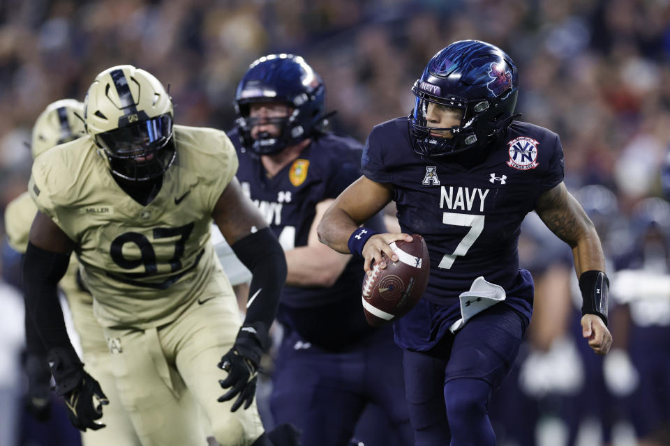 Navy QB Xavier Arline scrambles during the first half of Army's win over Navy on Dec. 9. (Danielle Parhizkaran/Getty Images)