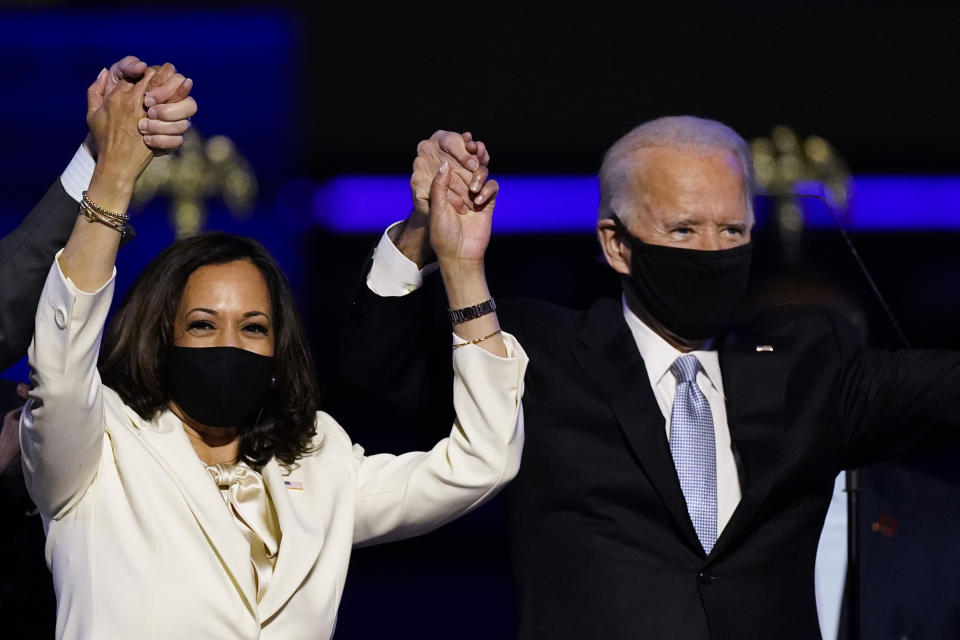 Vice President-elect Kamala Harris holds hands with President-elect Joe Biden and her husband Doug Emhoff as they celebrate in Wilmington, Del. Black policy leaders will play a pivotal role in President-elect Joe Biden’s transition team, marking one of the most diverse presidential agency review teams in history.