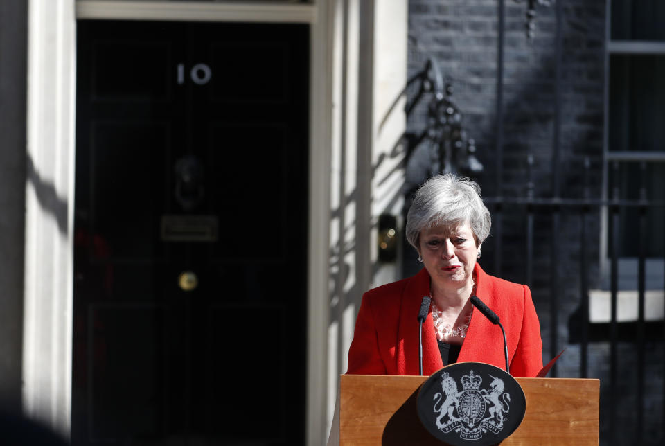 FILE - In this Friday, May 24, 2019 file photo, British Prime Minister Theresa May reacts as she makes a speech in the street outside 10 Downing Street in London, England. May has steped down as Conservative Party leader on June 7 and will serve as caretaker prime minister until her successor is chosen.(AP Photo/Alastair Grant, File)