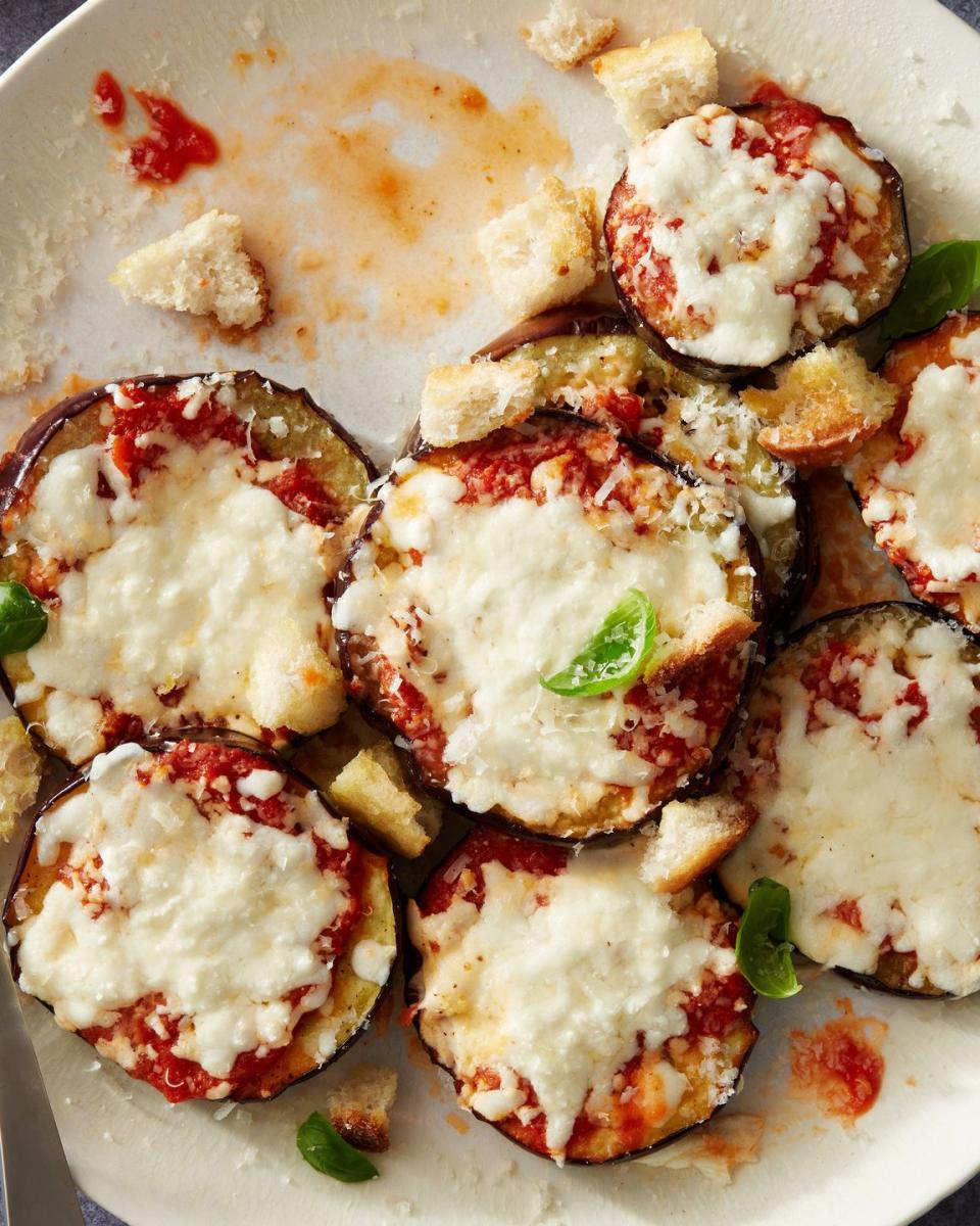 <p>This hands-off <a href="https://www.delish.com/cooking/recipe-ideas/a58245/easy-baked-eggplant-parmesan-recipe/" rel="nofollow noopener" target="_blank" data-ylk="slk:eggplant Parm;elm:context_link;itc:0;sec:content-canvas" class="link ">eggplant Parm</a> hits all the notes of our favorite fried (or <a href="https://www.delish.com/cooking/recipe-ideas/a22698129/baked-eggplant-parm-recipe/" rel="nofollow noopener" target="_blank" data-ylk="slk:baked;elm:context_link;itc:0;sec:content-canvas" class="link ">baked</a>!) versions, minus all the deep frying. If you're trying to eat more mindfully, check the label of your marinara sauce—lots are loaded with sugar. Avoid those and choose one with the fewest ingredients, or make your own <a href="https://www.delish.com/cooking/recipe-ideas/a24570093/marinara-sauce-recipe/" rel="nofollow noopener" target="_blank" data-ylk="slk:marinara sauce;elm:context_link;itc:0;sec:content-canvas" class="link ">marinara sauce</a> (it's easier than you'd think).</p><p>Get the <strong><a href="https://www.delish.com/cooking/recipe-ideas/a39854359/air-fryer-eggplant-parm-recipe/" rel="nofollow noopener" target="_blank" data-ylk="slk:Air Fryer Eggplant Parm recipe;elm:context_link;itc:0;sec:content-canvas" class="link ">Air Fryer Eggplant Parm recipe</a></strong>.</p>