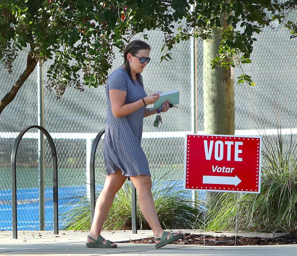 A voter walks into their polling location to vote on Aug. 23.