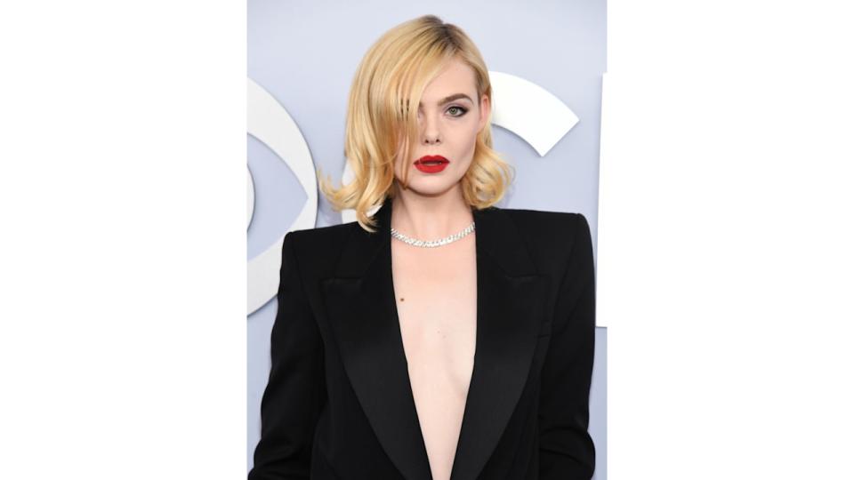 Elle Fanning at the 77th Annual Tony Awards held at the David H. Koch Theater at Lincoln Center on June 16, donning a smokey eye look and red lipstick