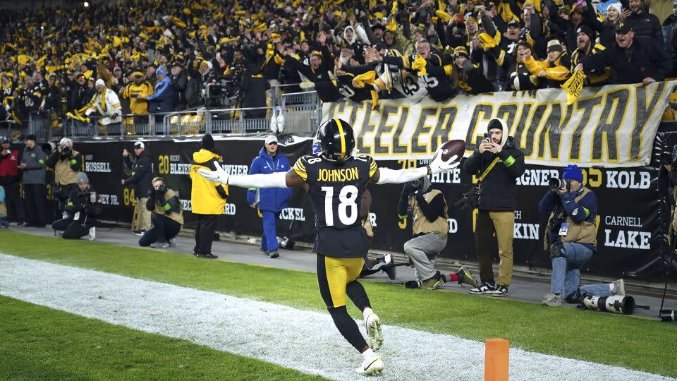 Johnson celebrates a touchdown against the Titans. - Matt Freed/AP