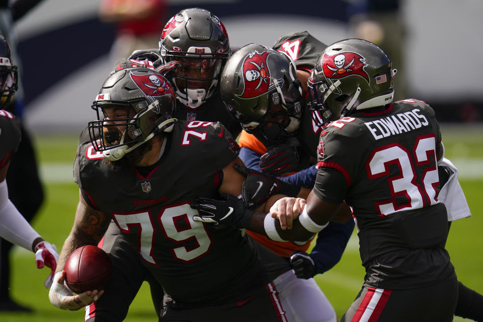 Tampa Bay Buccaneers defensive end Pat O'Connor (79) reacts with teammates after a blocking a punt second half of an NFL football game against the Denver Broncos, Sunday, Sept. 27, 2020, in Denver. (AP Photo/David Zalubowski)