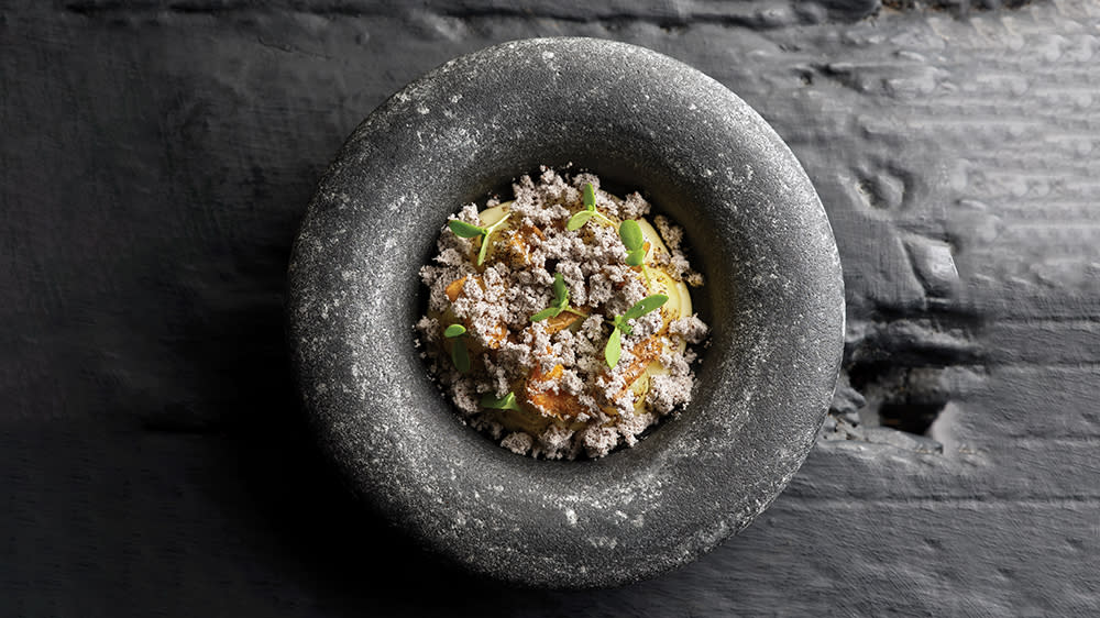 Bambino potatoes in onion ashes, Westcombe cheddar and pickled walnut at L’Enclume in Cartmel, England. - Credit: Cris Barnett