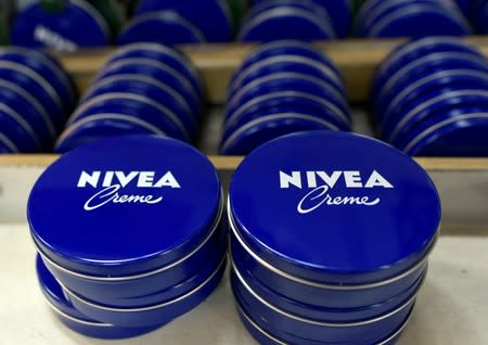 FILE PHOTO: Nivea tins are seen in a production line at the plant of German personal-care company Beiersdorf in Hamburg