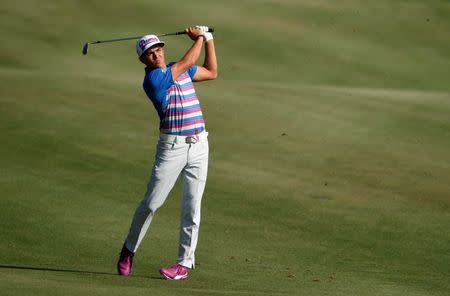 May 10, 2015; Ponte Vedra Beach, FL, USA; Rickie Fowler plays a shot from the 18th fairway during the final round of The Players Championship at TPC Sawgrass - Stadium Course. Mandatory Credit: John David Mercer-USA TODAY Sports