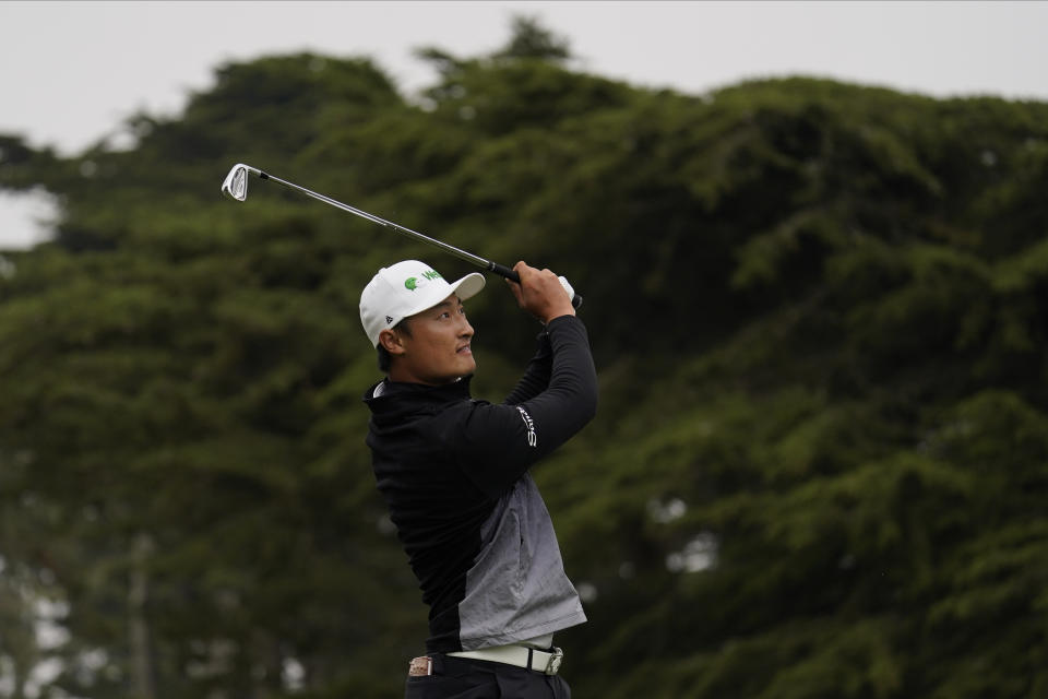 Li Haotong of China, watches his tee shot on the third hole during the third round of the PGA Championship golf tournament at TPC Harding Park Saturday, Aug. 8, 2020, in San Francisco. (AP Photo/Jeff Chiu)