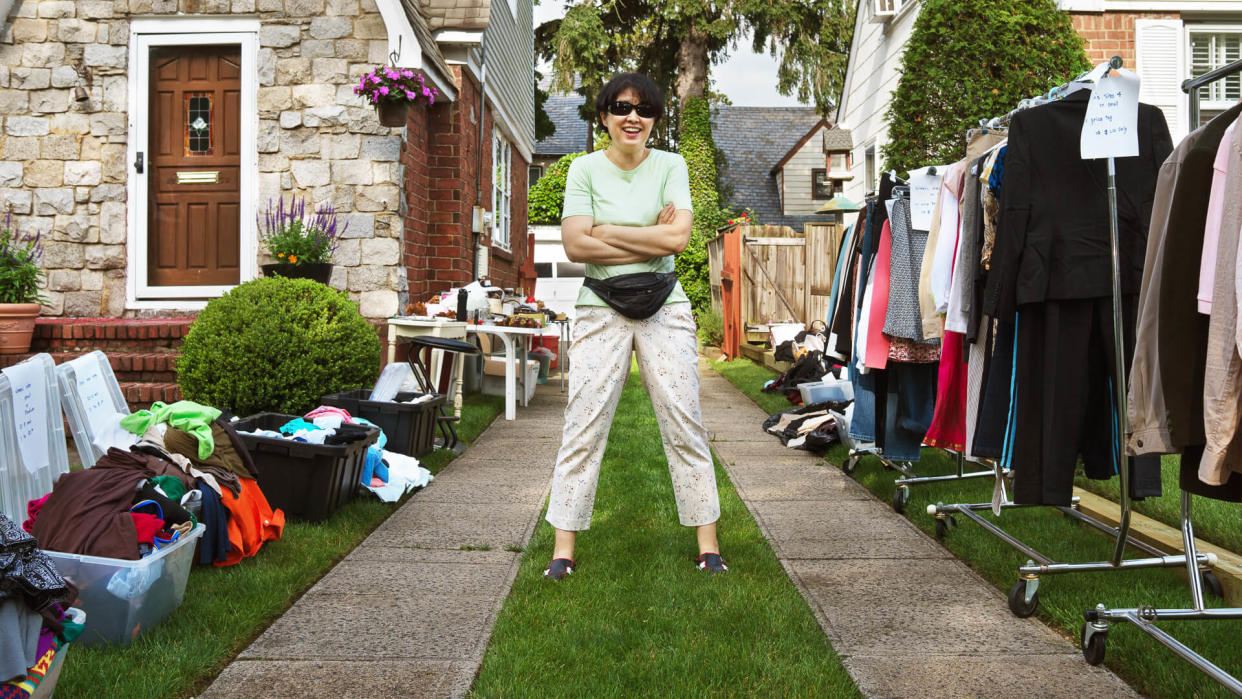 asian woman hosting yard sale