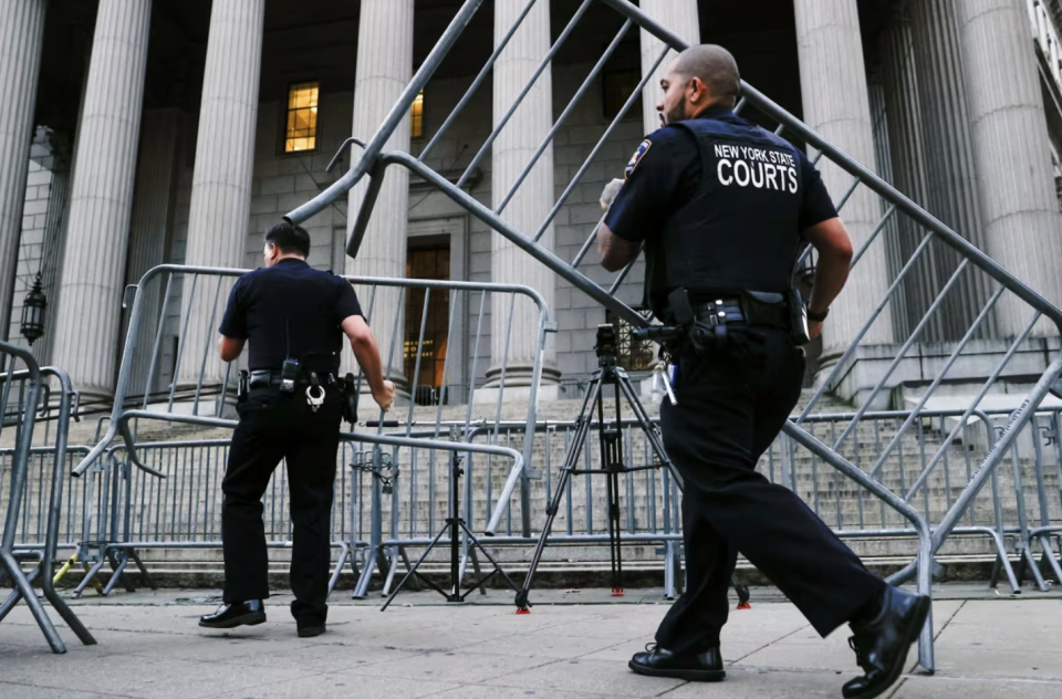 Selecting a jury will take days. The challenge: Finding 12 jurors and several alternates capable of remaining impartial toward Donald Trump. Seen here, police set up barriers before Trump's civil fraud trial in New York last year. (Eduardo Munoz/Reuters)