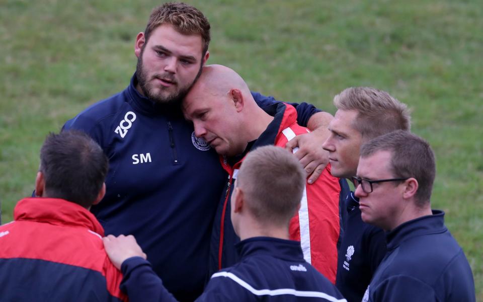 Players and club officials following a minute's silence at East Grinstead Rugby Club - Gareth Fuller/PA