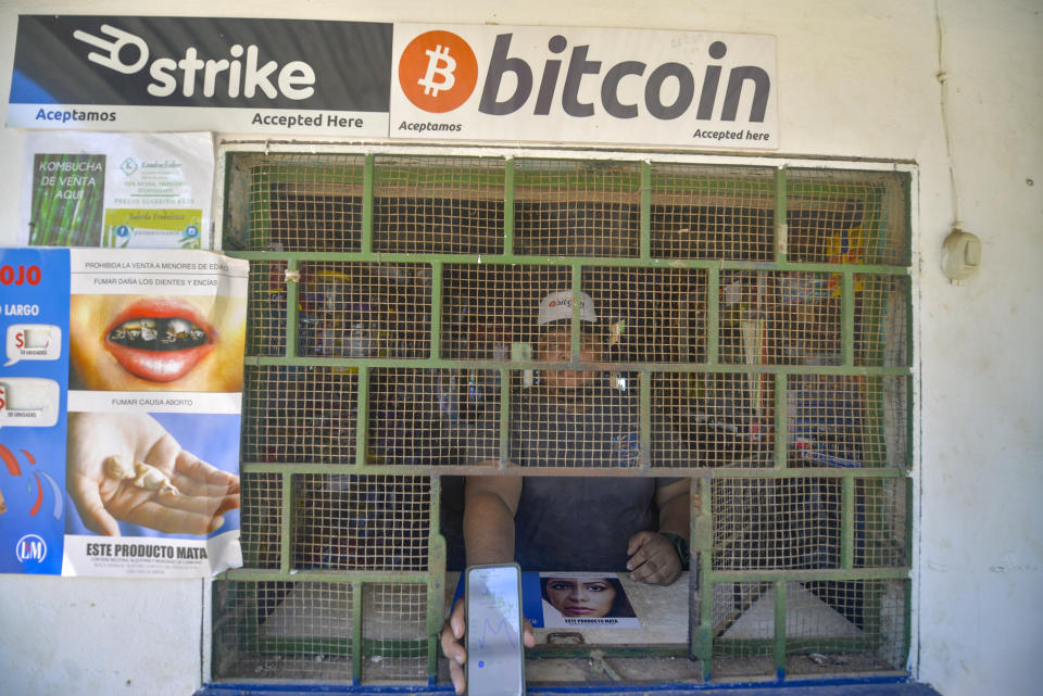 CHILTUIPAN, LA LIBERTAD, EL SALVADOR - 2021/06/07: A man seen at a store that accepts bitcoin while holding a cellphone with an application to receive Bitcoin.
Salvadoran President Nayib Bukele has announced that he will propose a law to the Congress, where his party controls a majority, for Bitcoin to become legal tender. El Salvador would become the first country in the world to accept a cryptocurrency as a legal tender. (Photo by Camilo Freedman/SOPA Images/LightRocket via Getty Images)