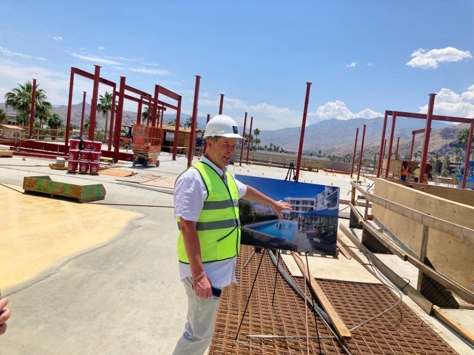The general manager of the Thompson Palm Springs Hotel pointed to a rendering showing how a pool will look while standing at the site of that pool last year.