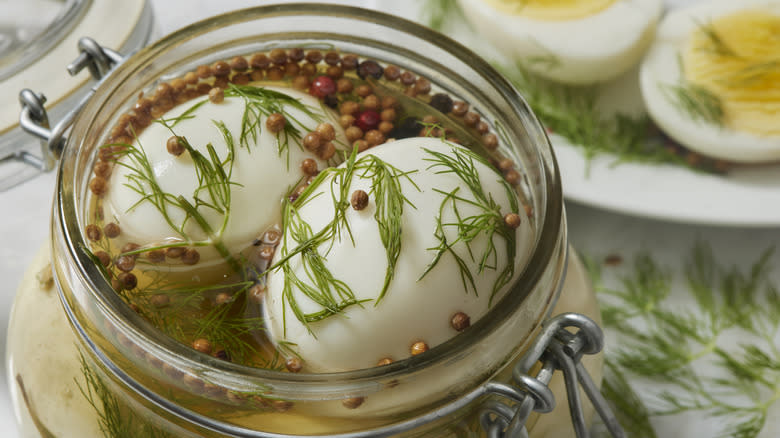 pickled eggs in herby brine