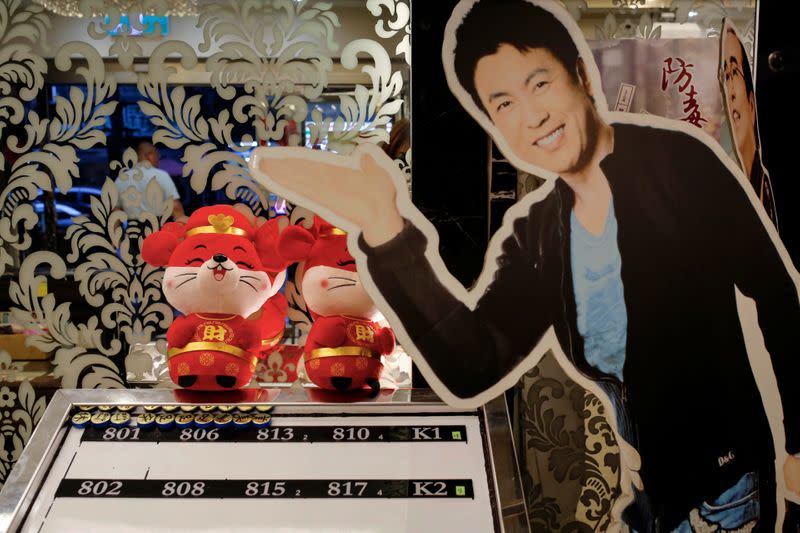 A cut-out figure of a Japanese actor is displayed at the entrance of a massage parlour that targets foreign tour groups in Taipei