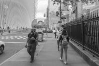 <p>Pedestrians make their way along Fulton Street next to St. Paul’s Chapel of Trinity Church on Wall Street, on Sept. 7, 2018. (Photo: Gordon Donovan/Yahoo News) </p>