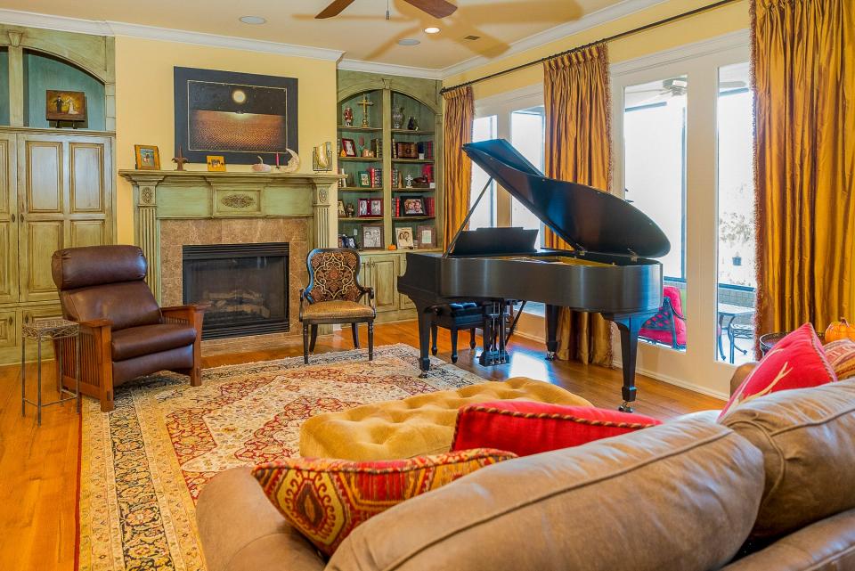 The den is built for comfort. The piano was given to Ginger as a young lady. She hopes to start playing again in the near future.