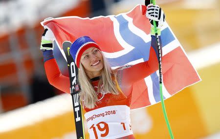 Alpine Skiing - Pyeongchang 2018 Winter Olympics - Women's Downhill - Jeongseon Alpine Centre - Pyeongchang, South Korea - February 21, 2018 - Ragnhild Mowinckel of Norway reacts during the victory ceremony. REUTERS/Kai Pfaffenbach