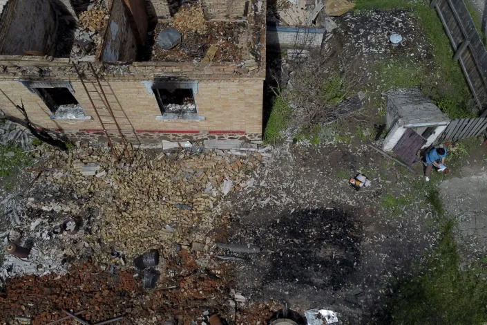 The home of Eduard Zelenskyy and Nila Zelinska destroyed by attacks in Potashnya, on the outskirts of Kyiv, Ukraine, Tuesday, May 31, 2022. (AP Photo/Natacha Pisarenko)