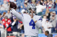 Dallas Cowboys quarterback Dak Prescott (4) warms up prior to an NFL football game against the New England Patriots, Sunday, Oct. 17, 2021, in Foxborough, Mass. (AP Photo/Steven Senne)