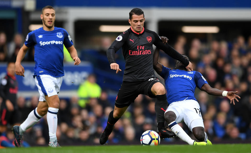 Granit Xhaka of Arsenal and Idrissa Gueye of Everton battle for possession during the Premier League match between Everton and Arsenal at Goodison Park on October 22, 2017 in Liverpool, England.