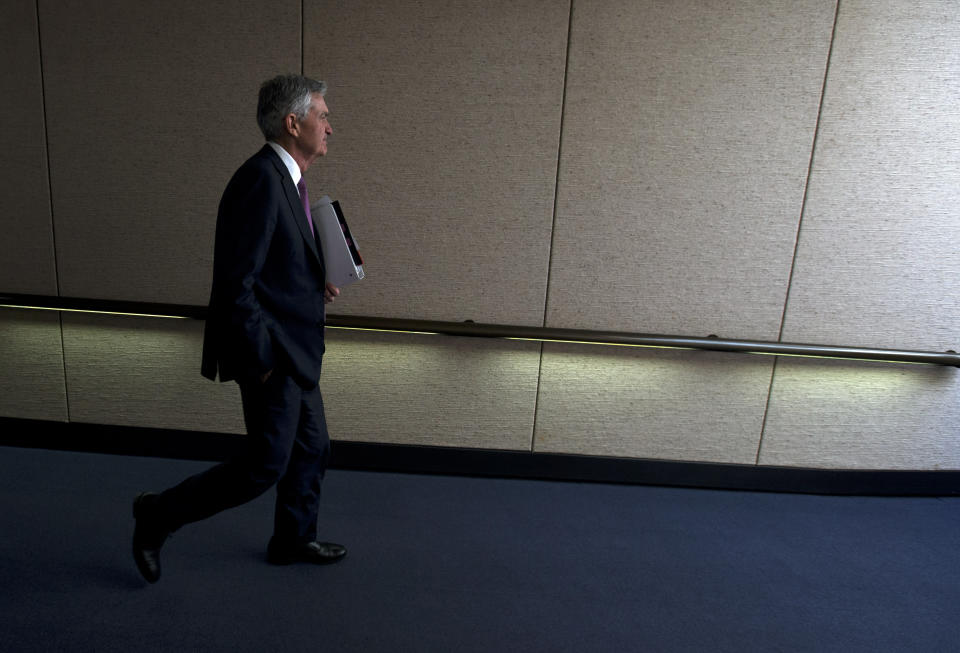 Federal Reserve Board Chair Jerome Powell leaves after the hearing on the economic outlook, on Capitol Hill in Washington, on Wednesday, Nov. 13, 2019. (AP Photo/Jose Luis Magana)