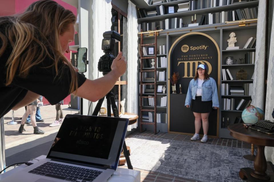 Attendee poses for pictures at Spotify’s Taylor Swift pop-up at The Grove. Getty Images