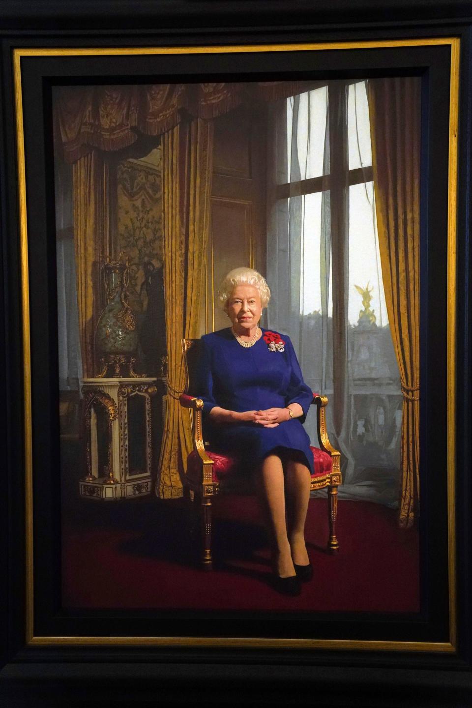 Another portrait of Queen Elizabeth II has been added to her collection. The full length portrait of the monarch wearing a spray of five poppies was painted by artist Darren Baker to commemorate the 90th anniversary of the Royal British Legion. It went on display at Clarence House in London, on Oct, 26, 2021, during the official launch of the centenary poppy appeal.