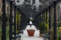 A waiter walks at the newly restored Royal Gardens in Venice, Italy, Tuesday, Dec. 17, 2019. Venice’s Royal Gardens were first envisioned by Napolean, flourished under Austrian Empress Sisi and were finally opened to the public by the Court of Savoy, until falling into disrepair in recent years. After an extensive restoration, the gardens reopened Tuesday as a symbol both of the lagoon city’s endurance and the necessity of public-private partnerships to care for Italy’s extensive cultural heritage. (AP Photo/Antonio Calanni)