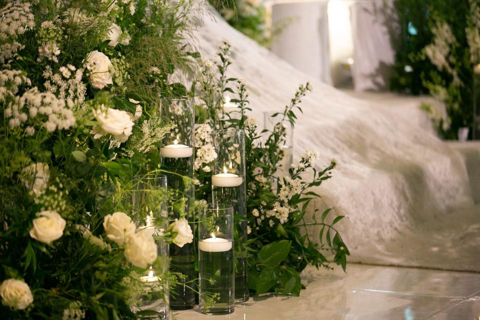 Wild delphinium, Caspia, Queen Anne’s lace, wild grasses, and floating candles.