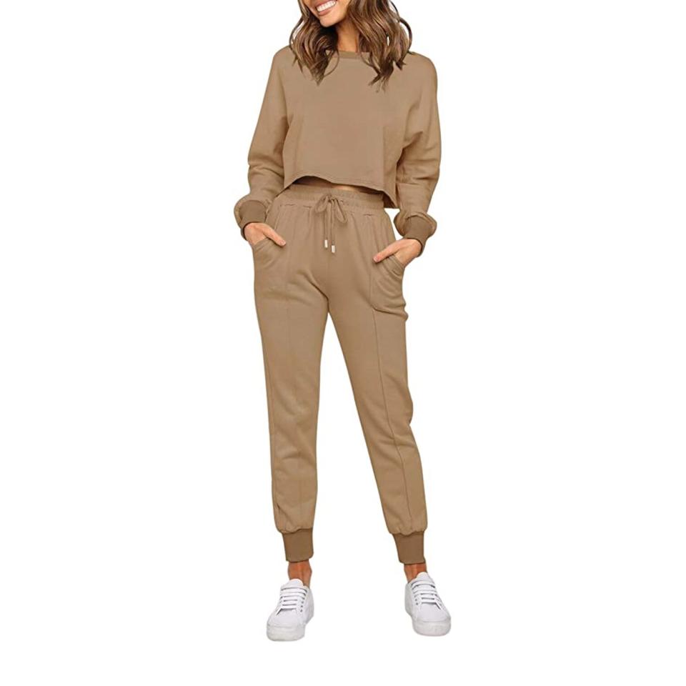 woman wearing tan sweat suit and white sneakers