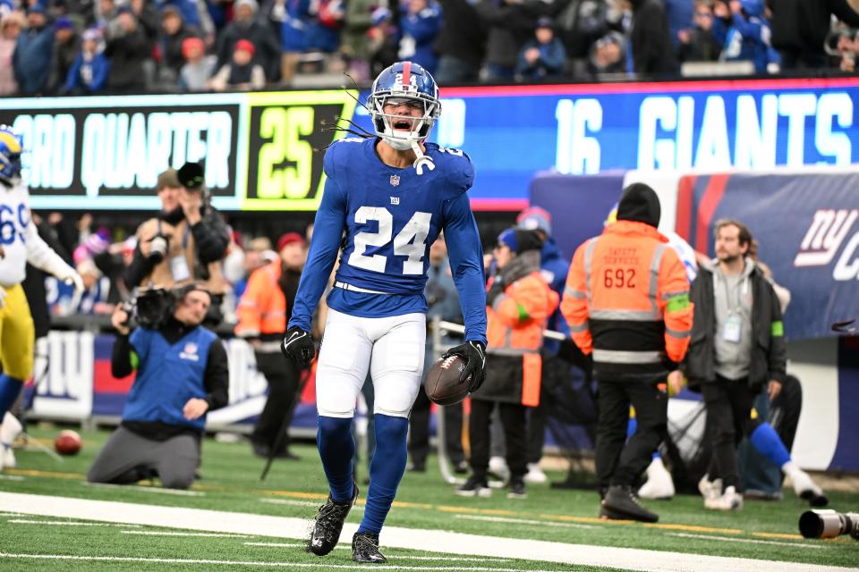 EAST RUTHERFORD, NEW JERSEY - DECEMBER 31: Dane Belton #24 of the New York Giants celebrates after an interception during the third quarter against the Los Angeles Rams at MetLife Stadium on December 31, 2023 in East Rutherford, New Jersey. (Photo by Mike Lawrence/Getty Images)