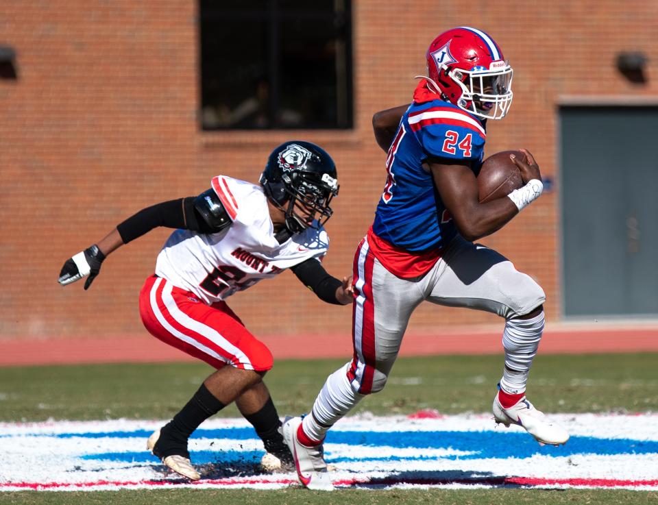 Jefferson's Malaki Starks (24) runs the ball into the end zone for a touchdown during the first half of a GHSA playoff football game between the Jefferson Dragons and the Mt. Zion Bulldogs at Jefferson Memorial Stadium in Jefferson, Ga., on Saturday, Nov. 28, 2020. Jefferson blew out Mt. Zion 65-0 to advance to the next round of the playoffs.