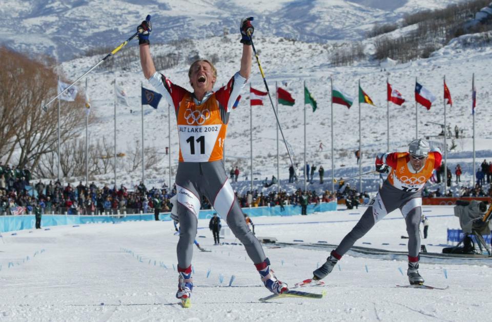 Austria’s Christian Hoffmann celebrates finishing second and winning the silver medal as teammate Mikhail Botvinov wins the bronze during the men’s 30K Olympic cross-country race at Soldier Hollow on Feb. 9, 2002. | Tom Smart, Deseret News