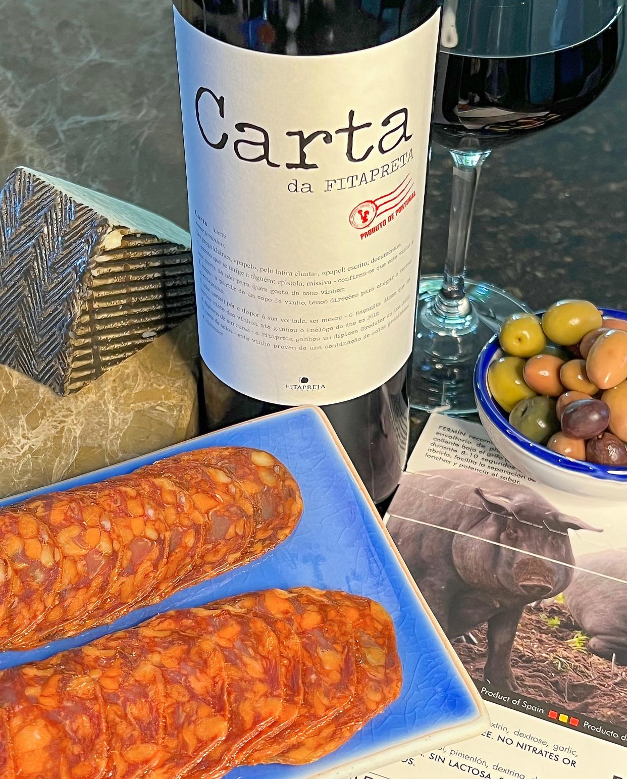 A glass of Portuguese red blend Carta da Fitapreta pairs nicely with Fermin iberico chorizo.